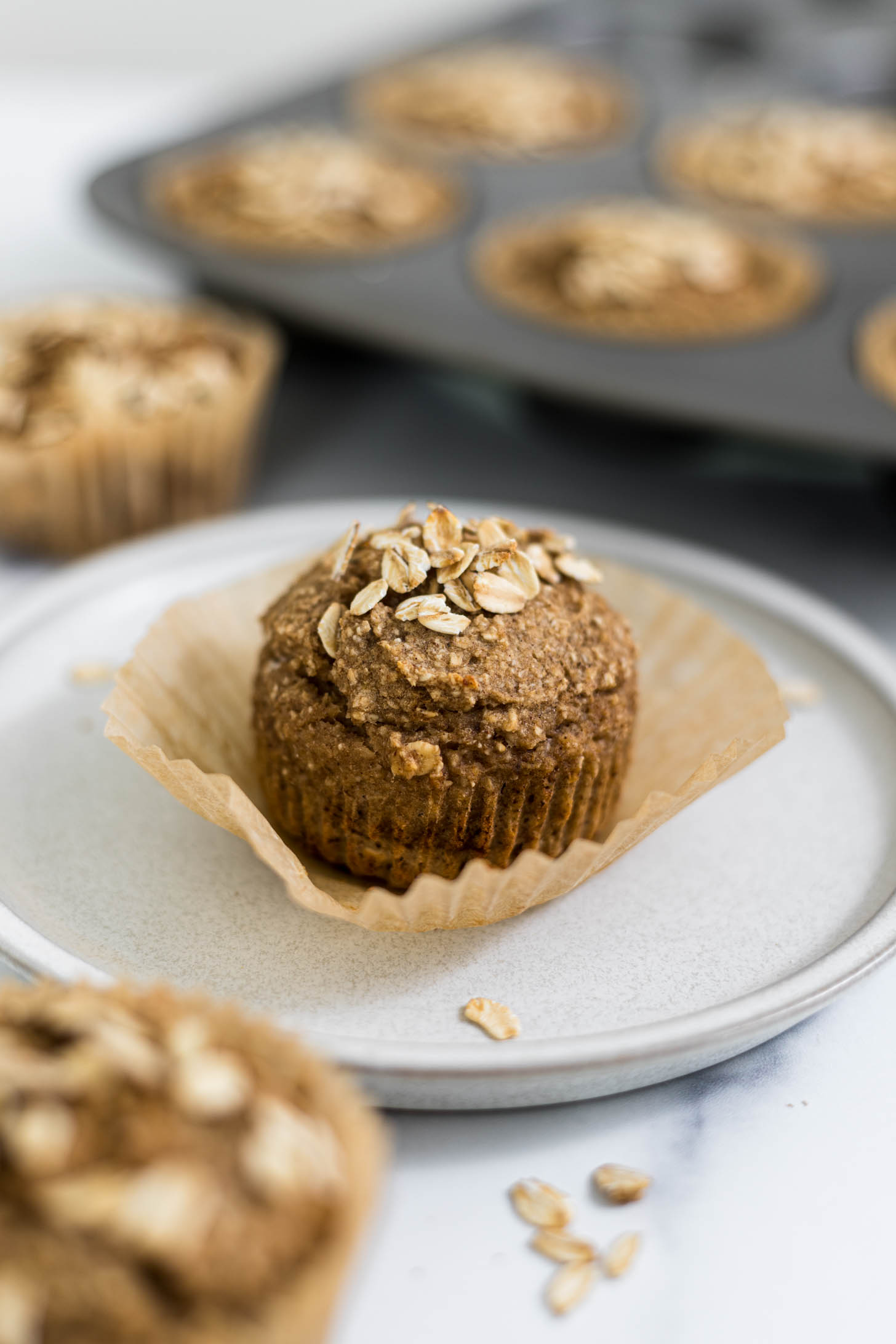 A Banana Applesauce Muffin on the plate. 