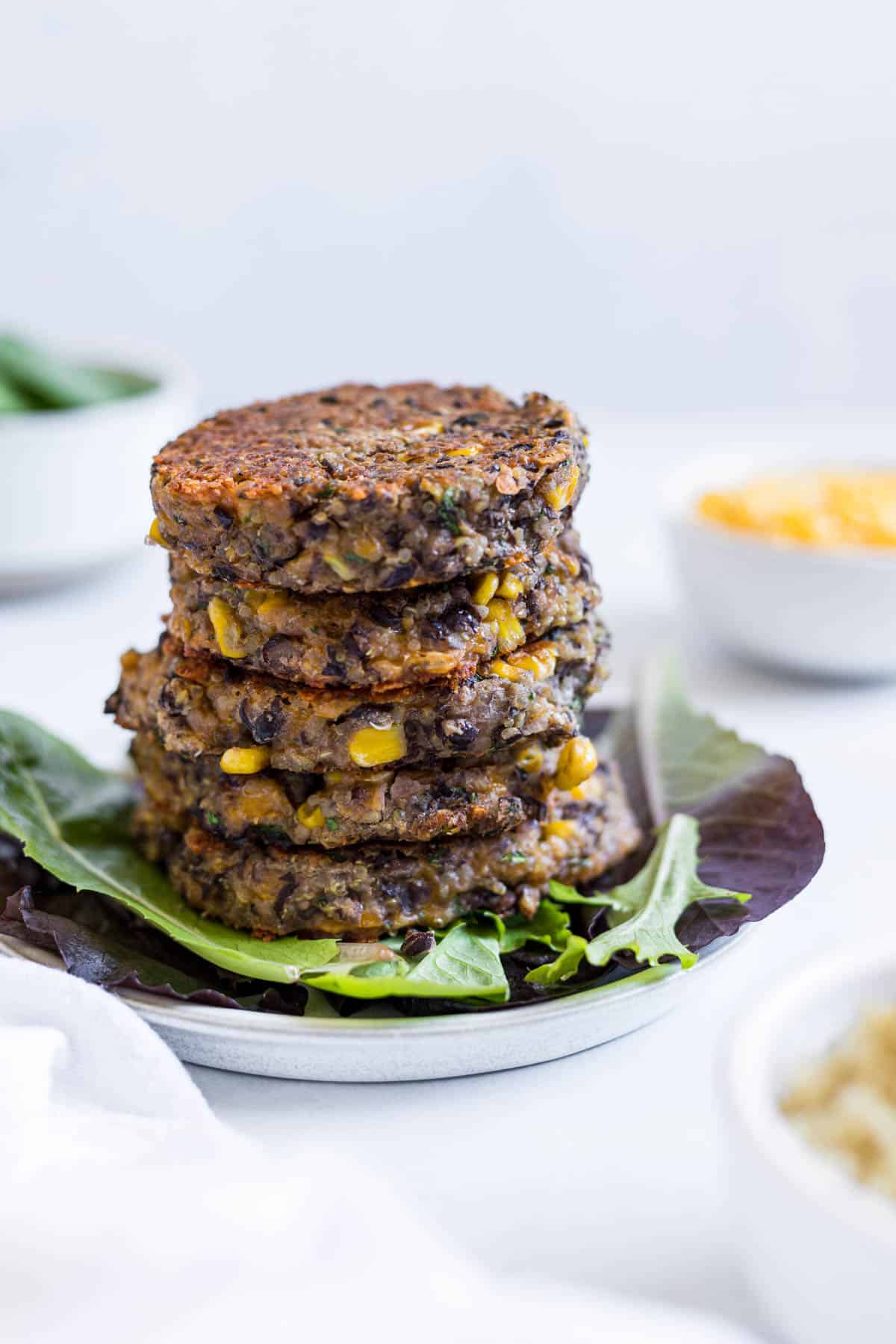 A stack of black bean fritters with quinoa.