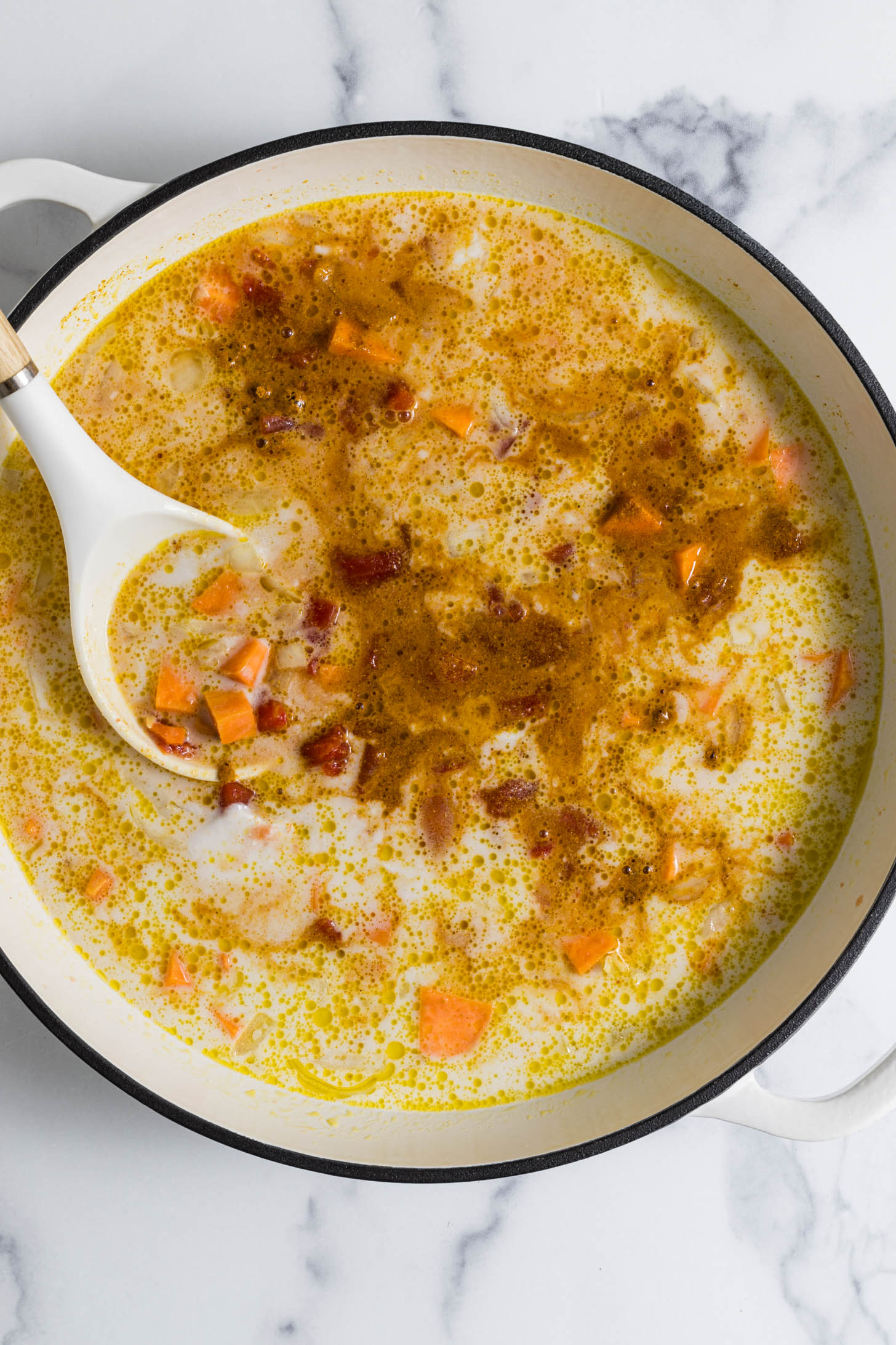 Liquid ingredients added to the pot.