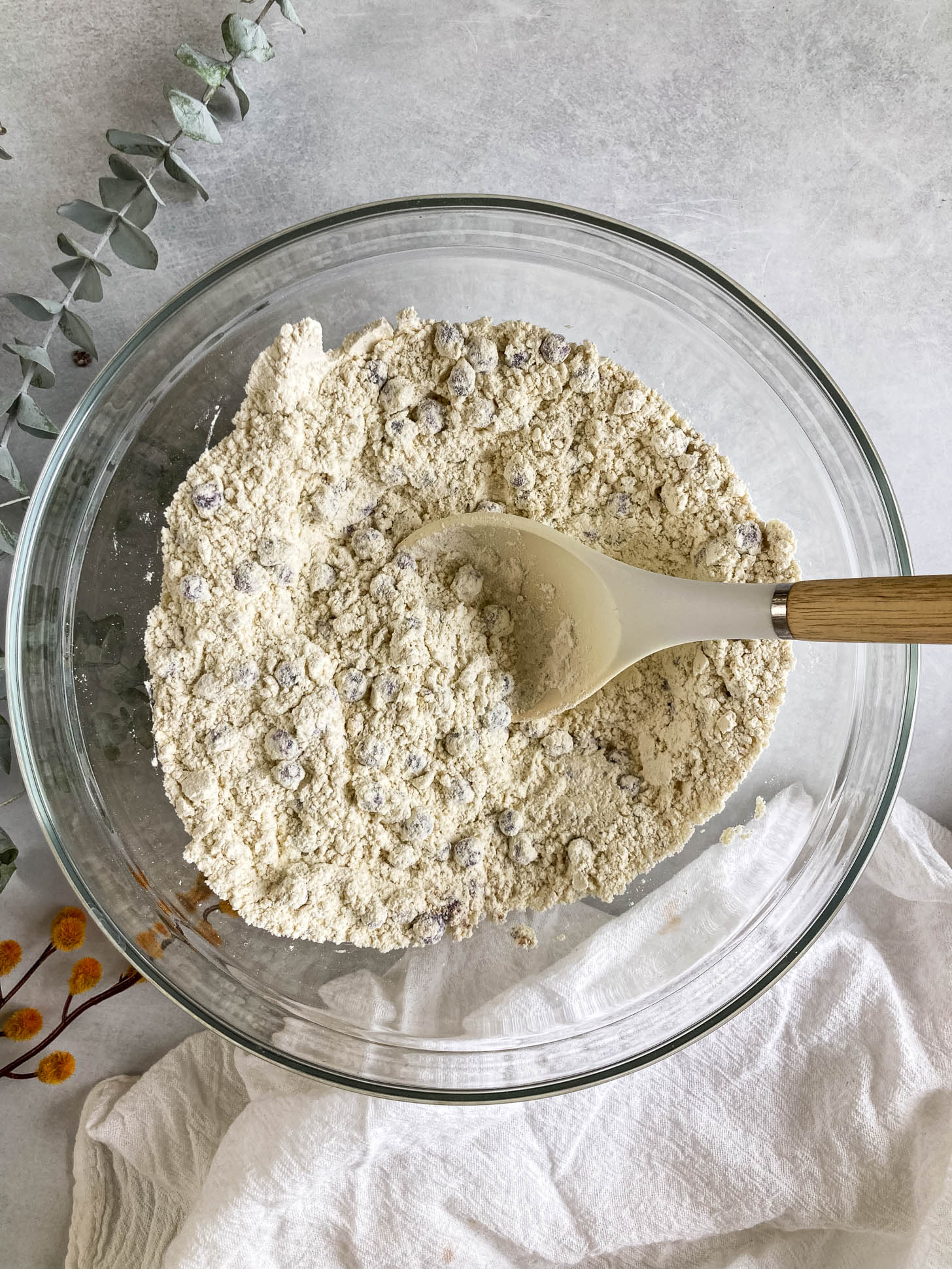 Flour mixture with blueberries mixed in.