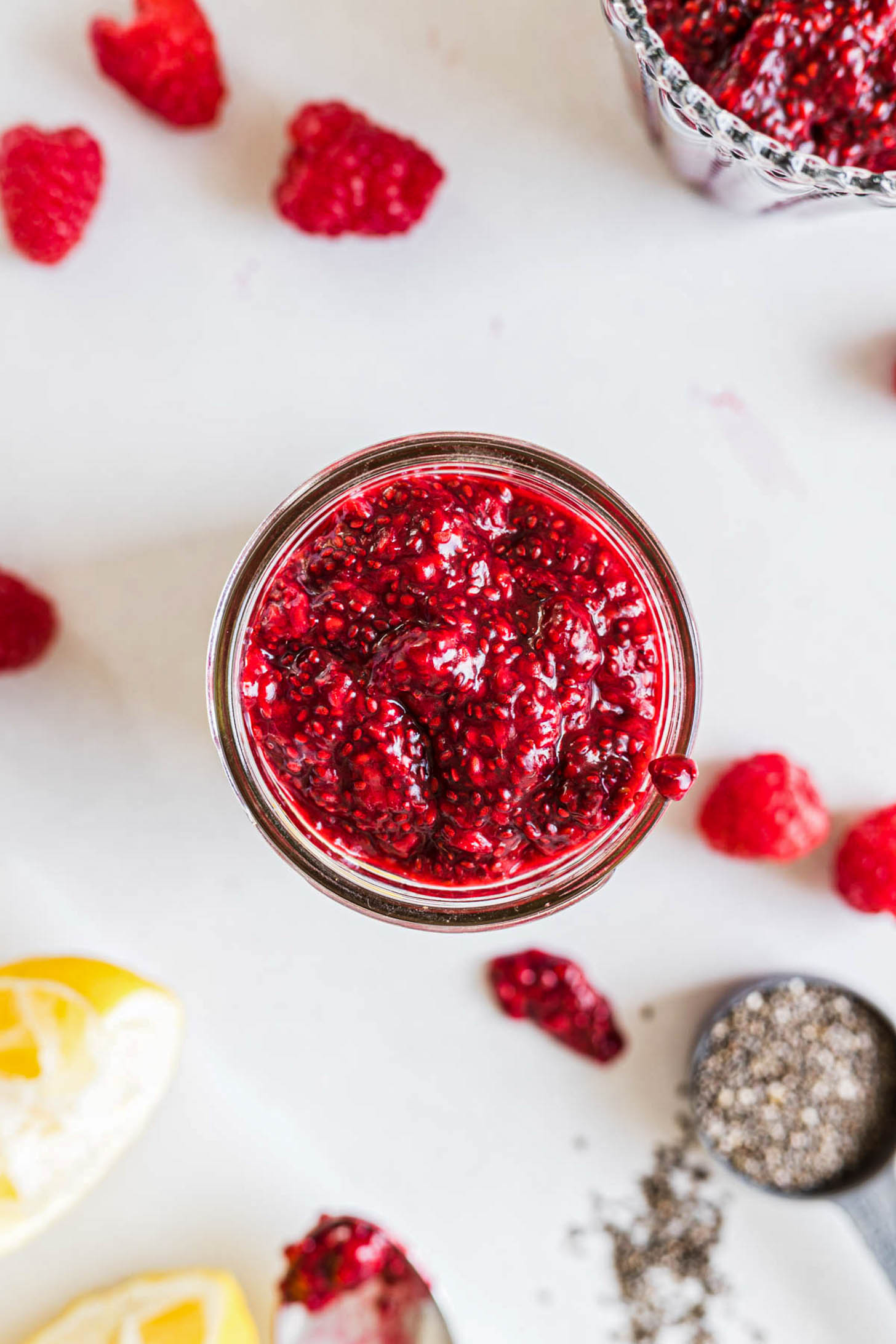 Overhead view of raspberry chia seed jam in a jar.