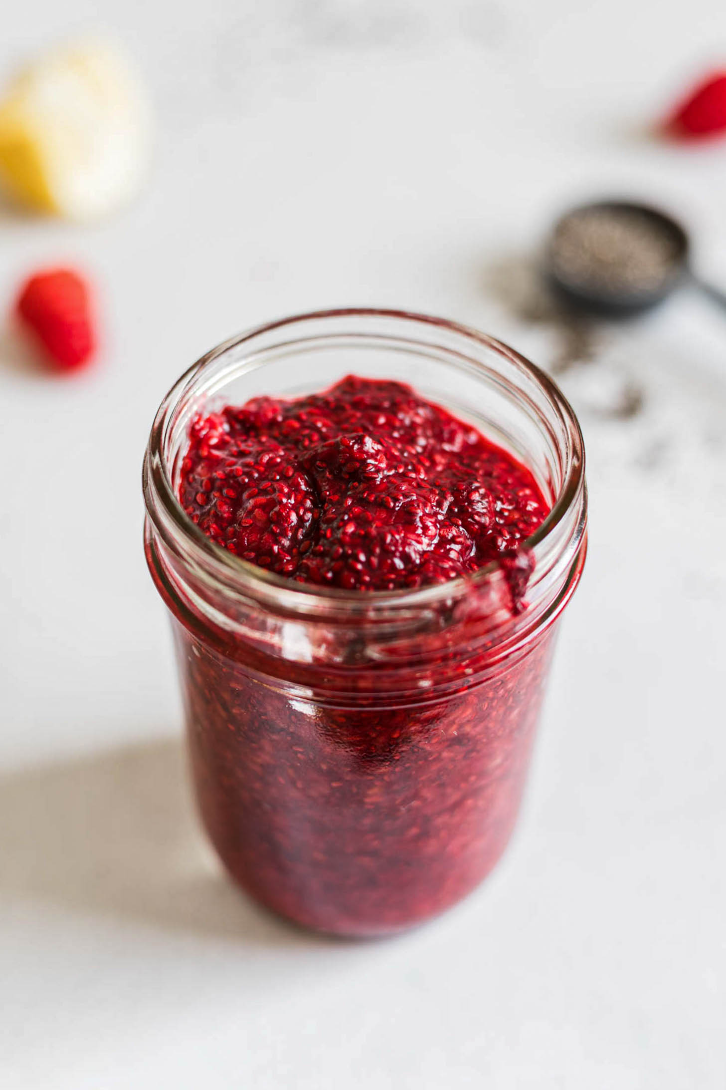 Raspberry chia jam in a mason jar.