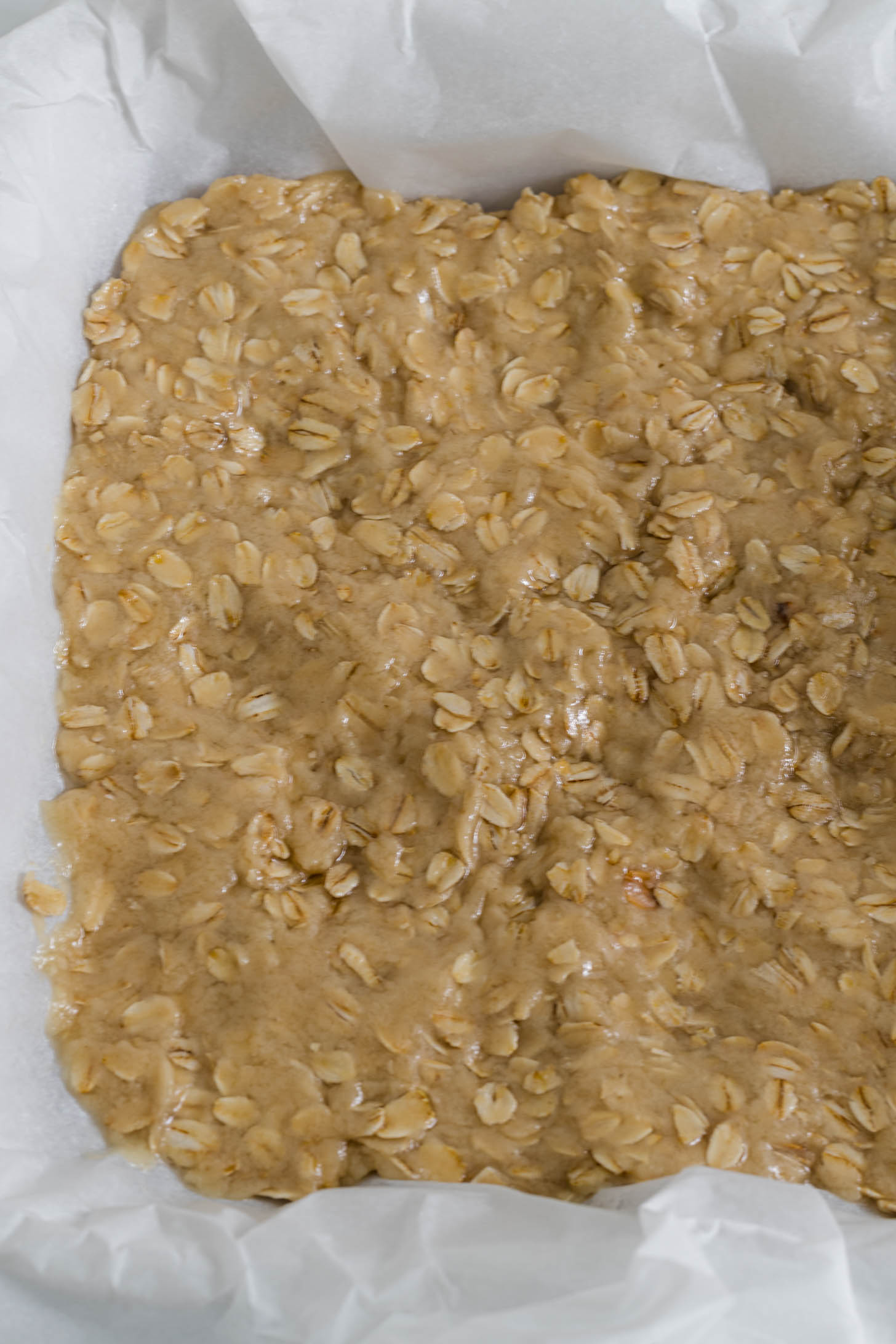 Dough is spread out in baking dish.