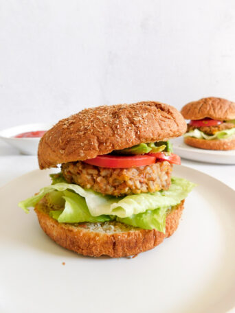 A veggie burger on a plate.