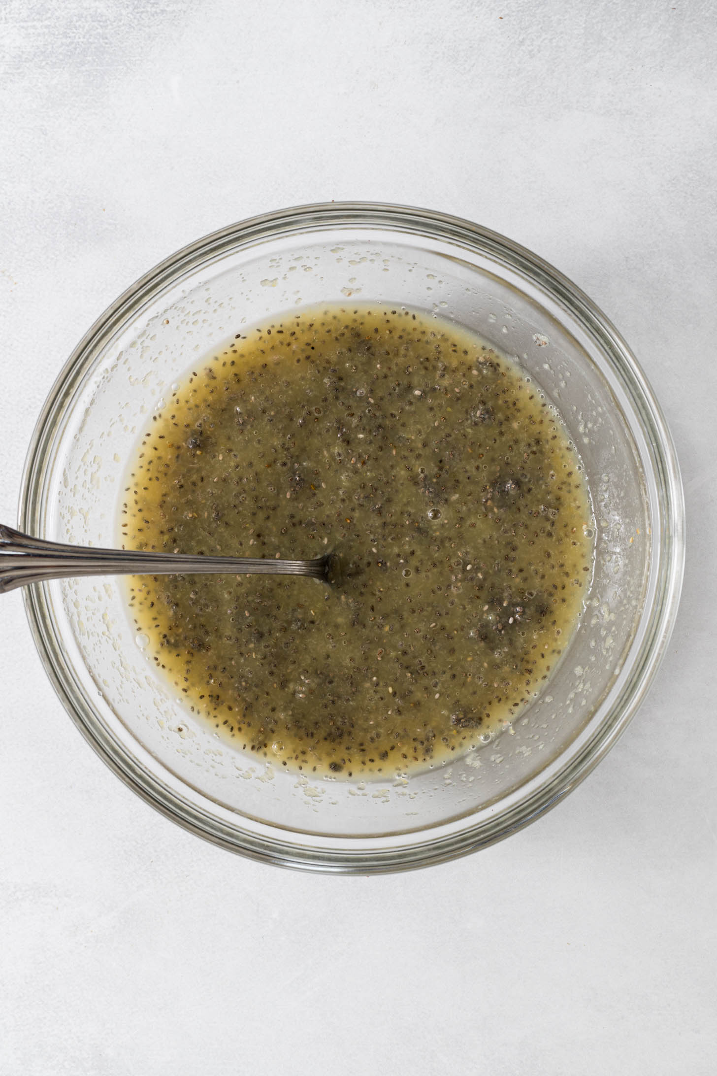 Chia egg and wet ingredients in a mixing bowl.