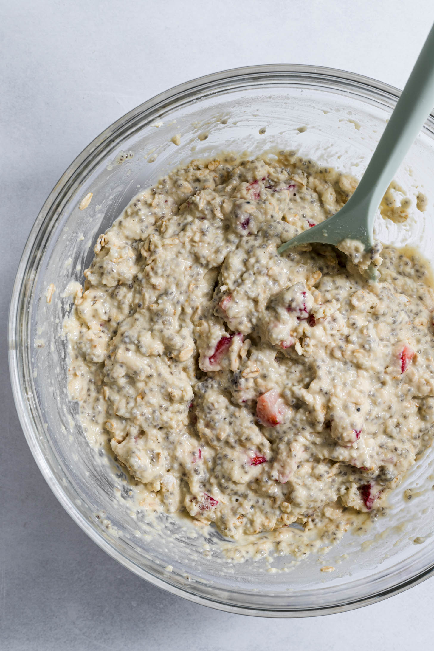 Wet and dry ingredients mixed together in a bowl.