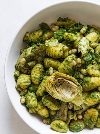 Pesto gnocchi in a serving bowl.