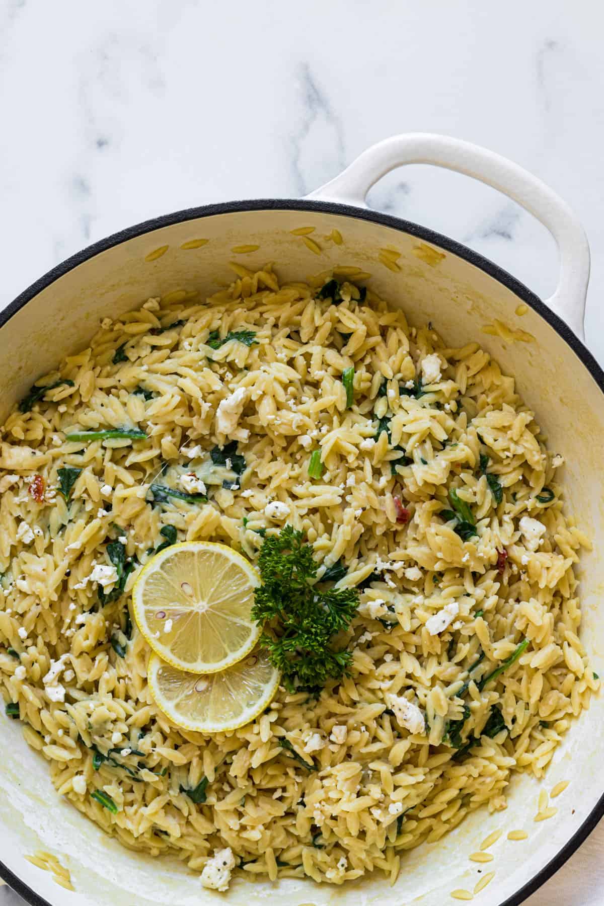 A pan of Orzo With Spinach and Feta. 