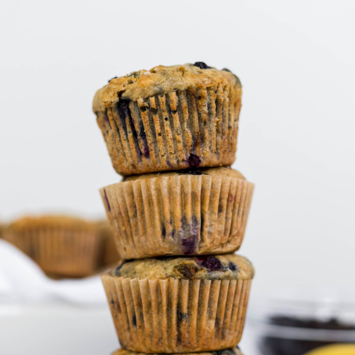 Banana blueberry muffins in a stack.