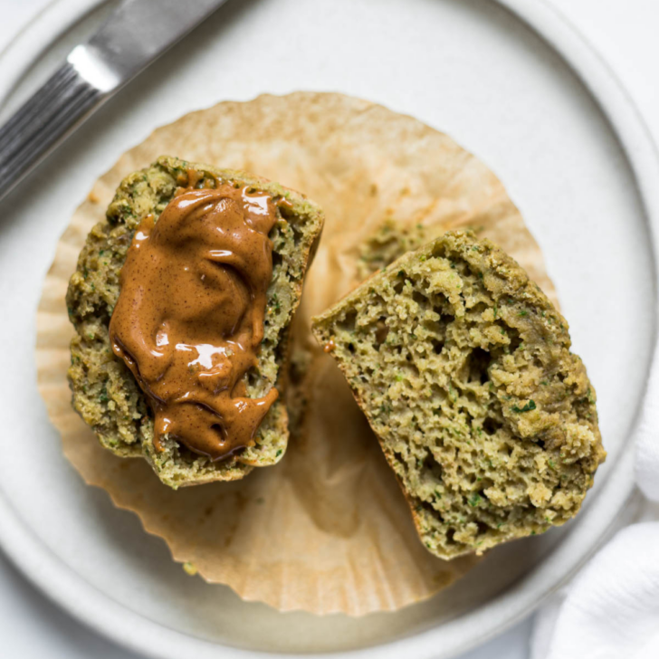 Spinach Banana Muffin cut in half with peanut butter.