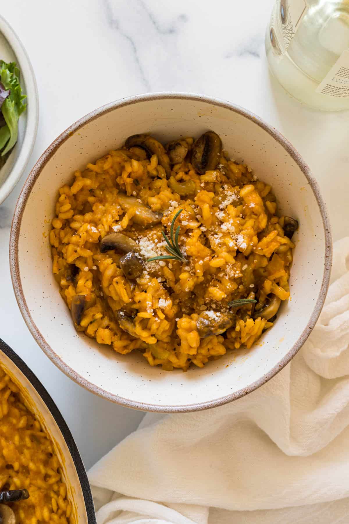 A bowl of pumpkin and mushroom risotto.