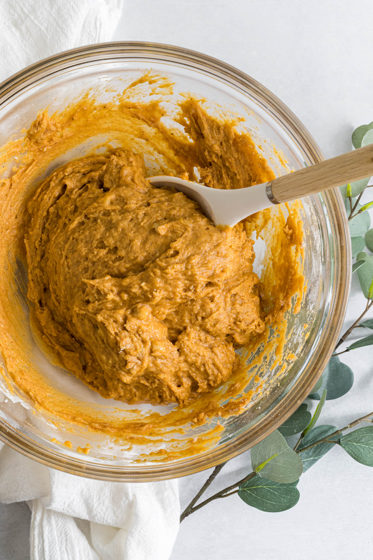 Dry ingredients and wet ingredients mixed together in a bowl.