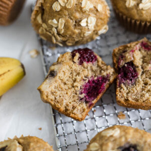 Close up of half of a blackberry muffin laying on it's side.