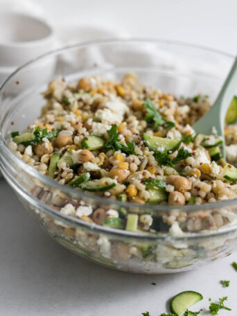 Harvest Grain Salad in a large bowl with a spoon in it.