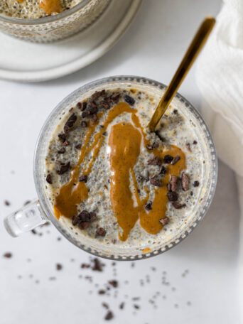 Overhead view of peanut butter chia pudding with a peanut butter drizzle on it.