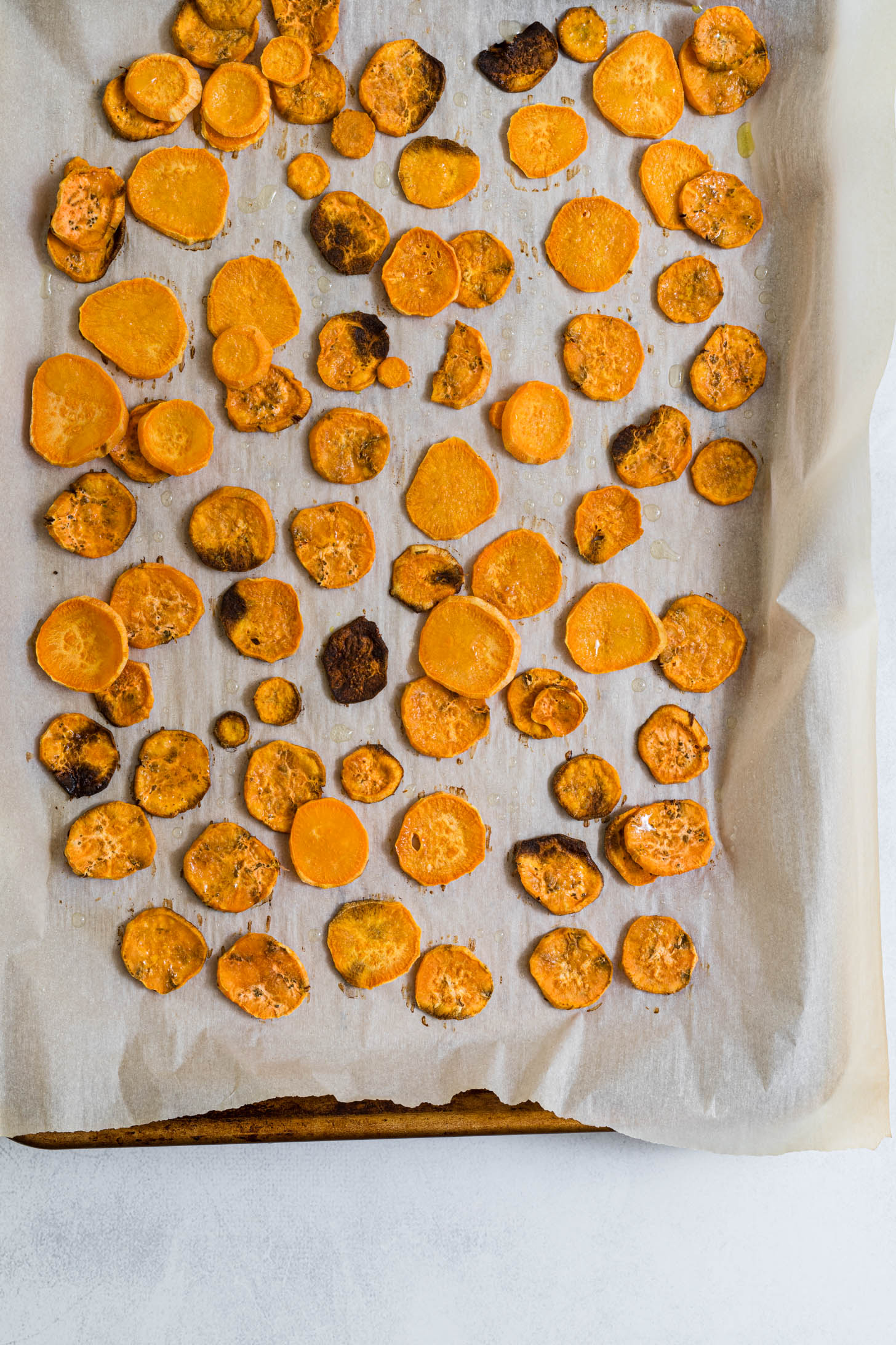 Roasted sweet potatoes on a baking sheet.