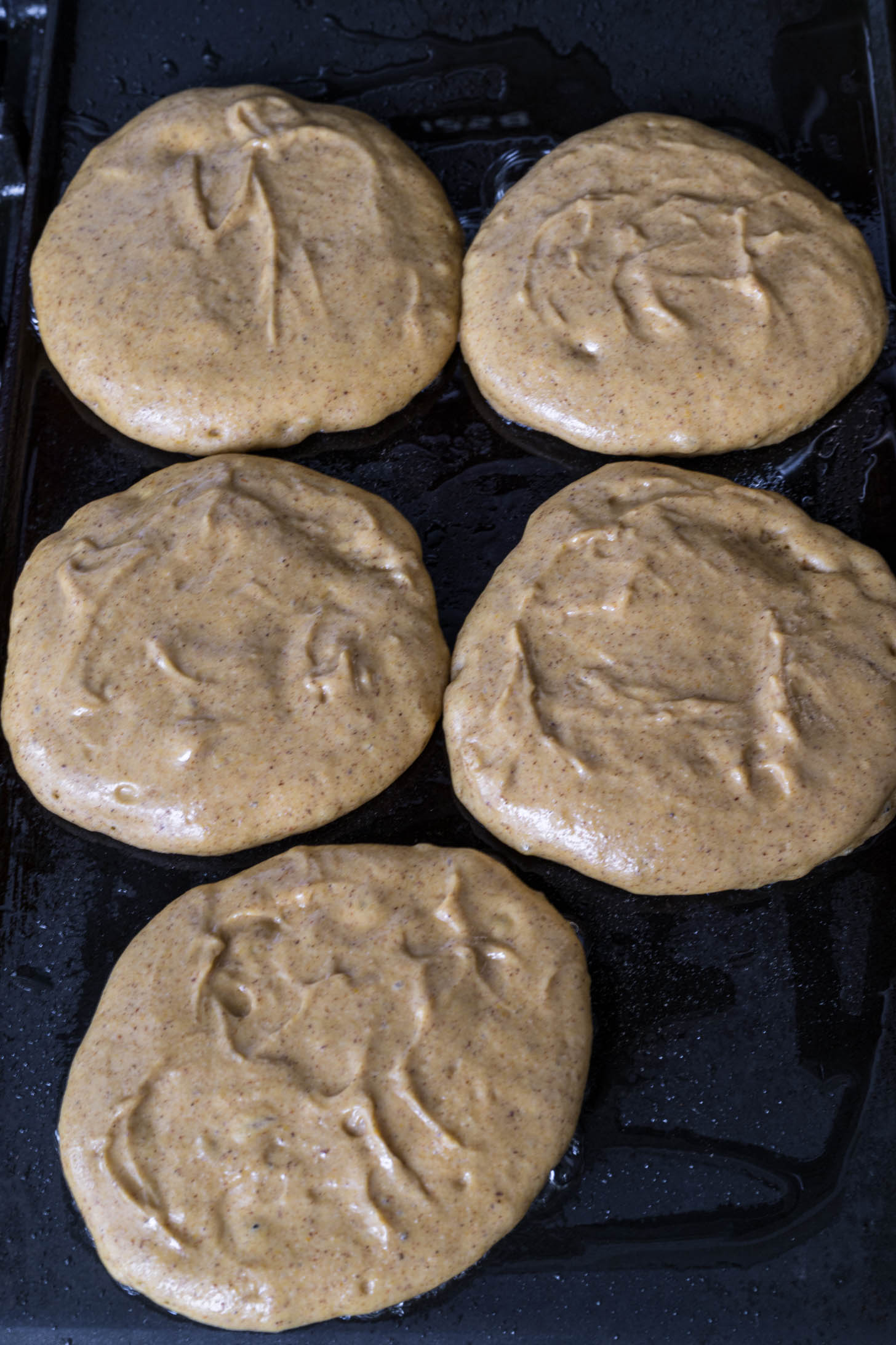 Pancakes on a griddle.