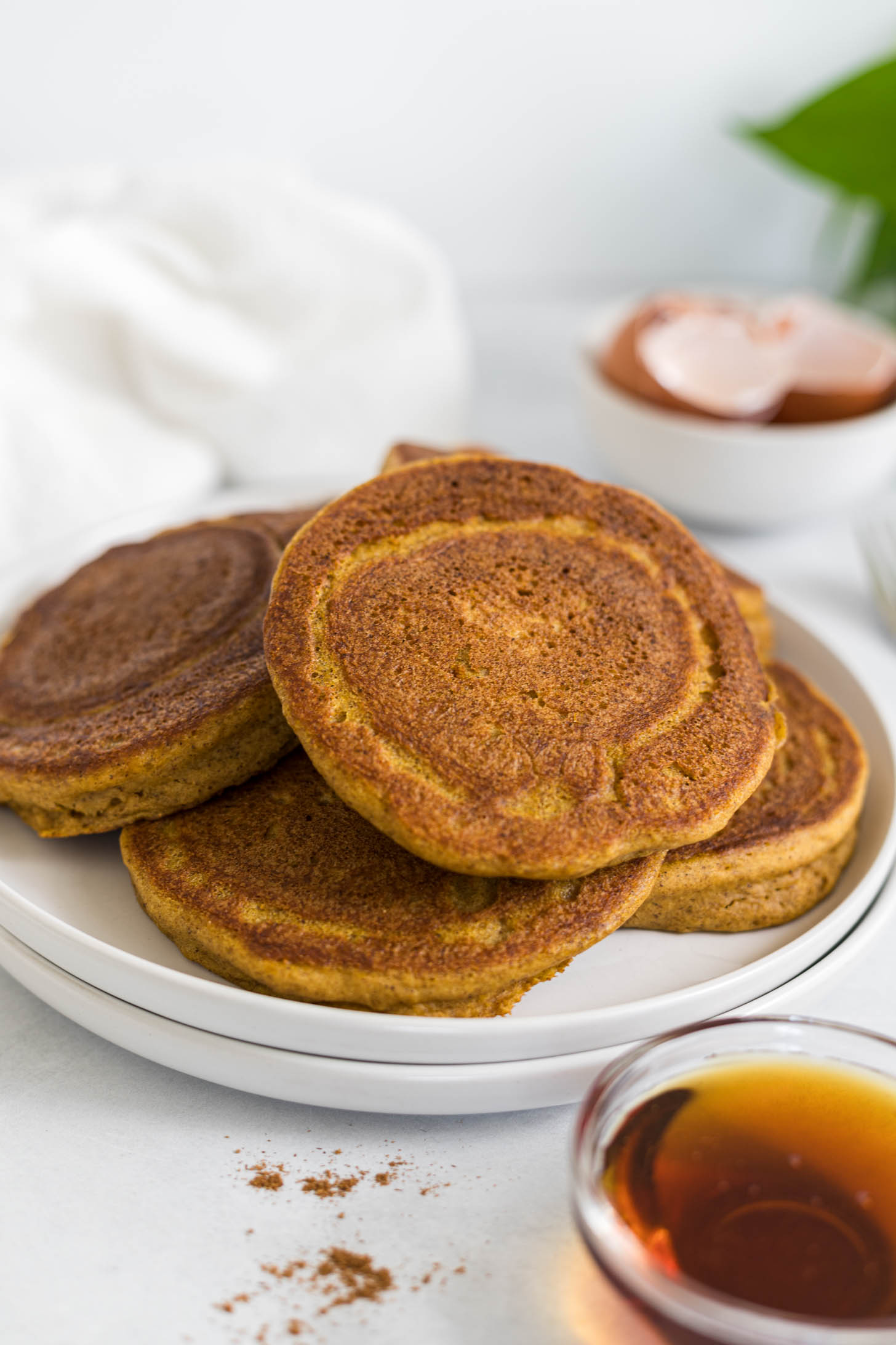 A group of pancakes on a plate.