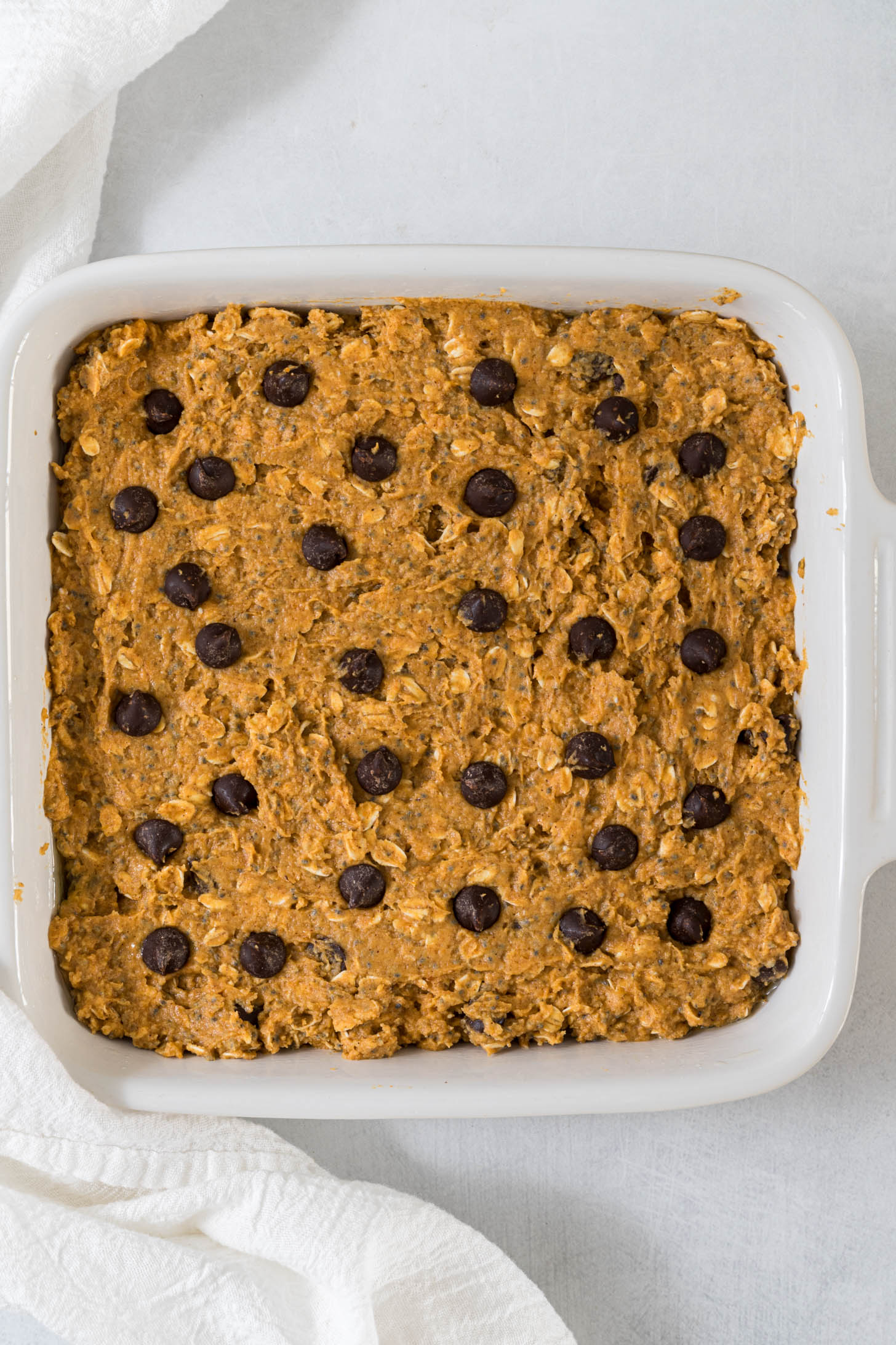 Pumpkin bar batter in a baking dish.