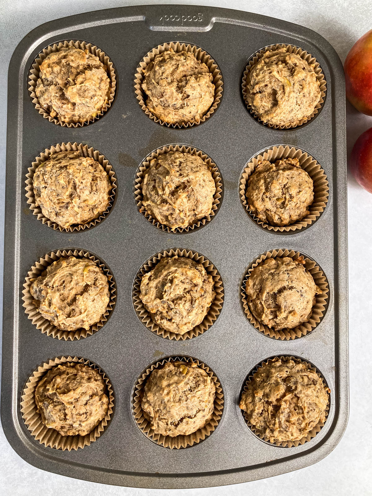 Cooked muffins in a muffin pan.