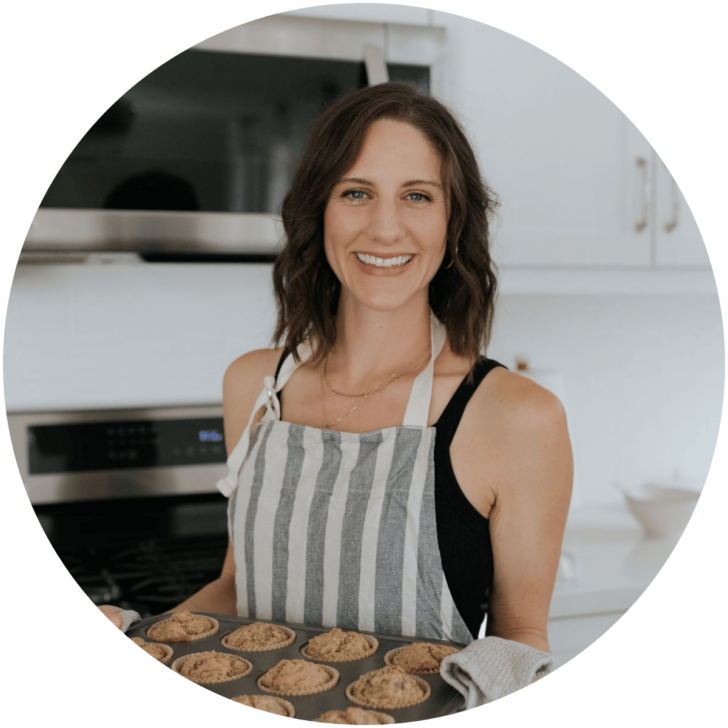 Kaileigh Gaffney from Supermom Eats holding a muffin tray.